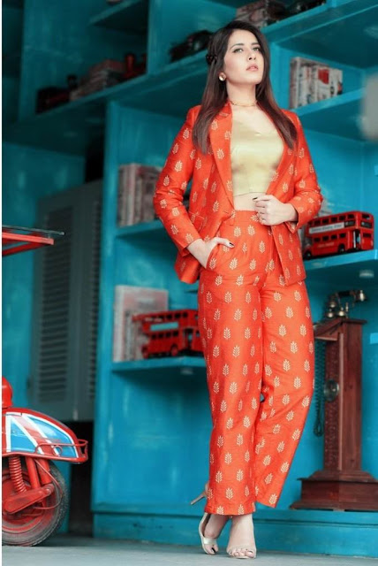 Raashi Khanna latest Photo Shoot In Long Hair Orange Dress 13